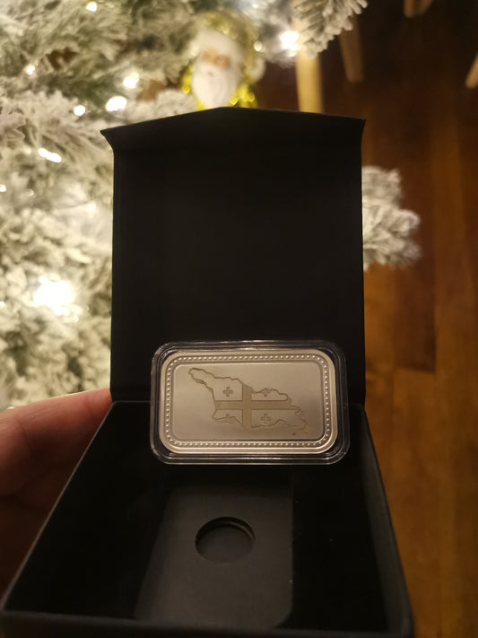 31.15 გრამიამი 999.9 სინჯის ვერცხლის ქარხნისიერ დაბეჭდილი ზოდი, გრავირებით